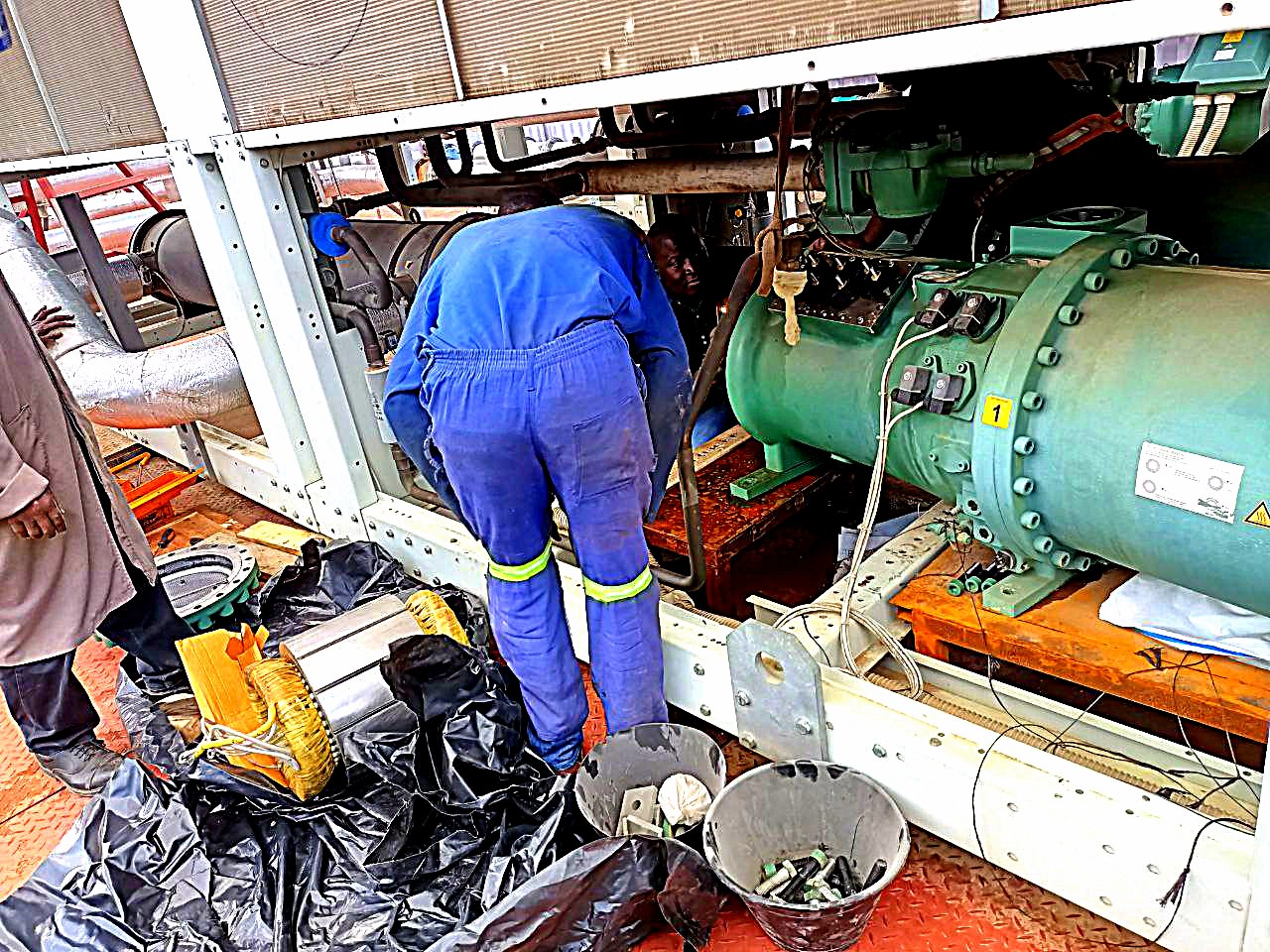 Climafrost technician servicing a refrigeration compressor